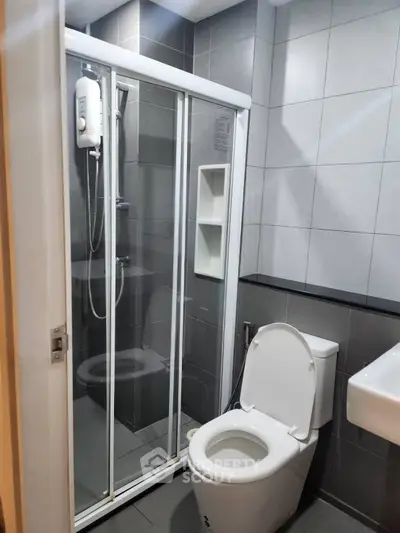 Modern bathroom with sleek shower enclosure and contemporary fixtures