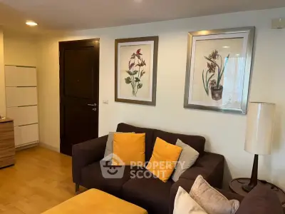 Cozy living room with stylish decor and comfortable seating in modern apartment.