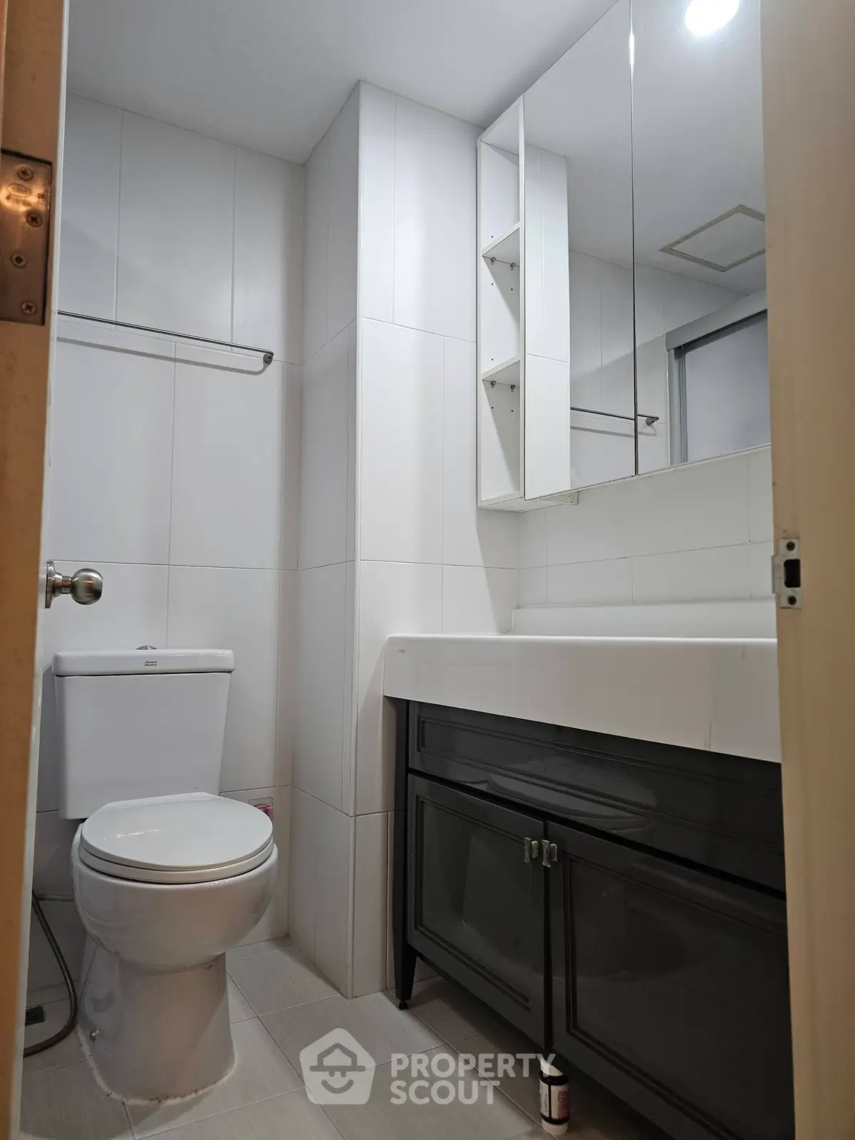 Modern bathroom with sleek fixtures and ample storage space.