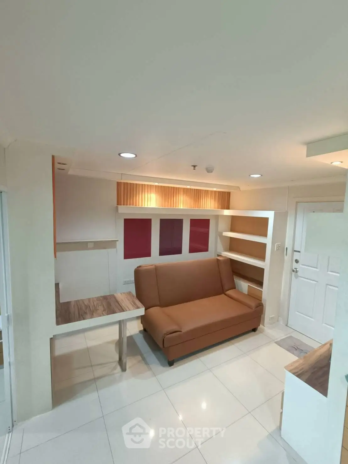 Modern compact living room with sleek design and built-in shelves