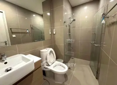 Modern bathroom with glass shower and sleek fixtures