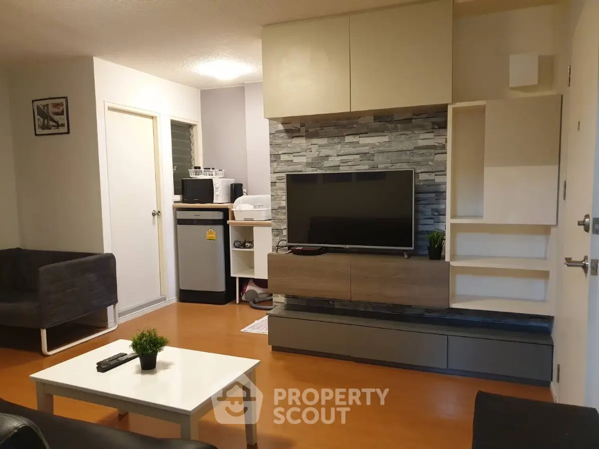 Modern living room with stylish TV unit and cozy seating area