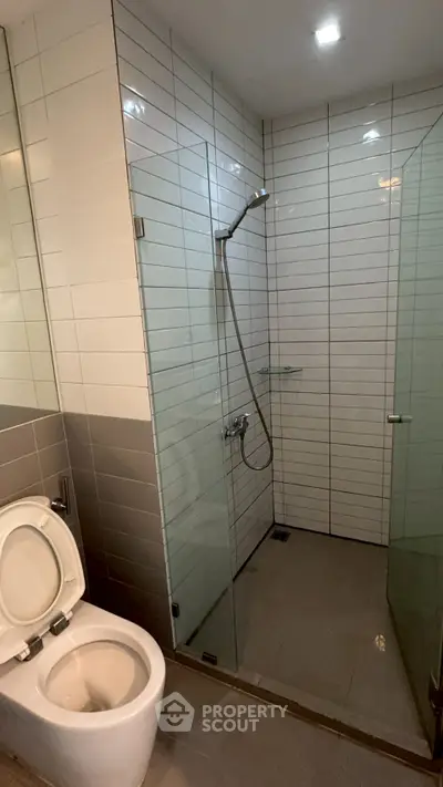 Modern bathroom with glass shower and sleek tile design