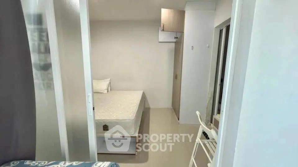Compact bedroom with minimalist design and white furniture