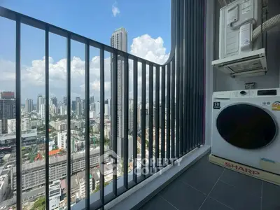Stunning high-rise balcony with city skyline view and modern laundry setup.