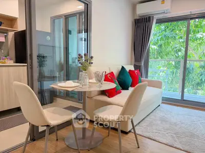 Charming modern living room with cozy dining area and lush green view, perfect for urban living.