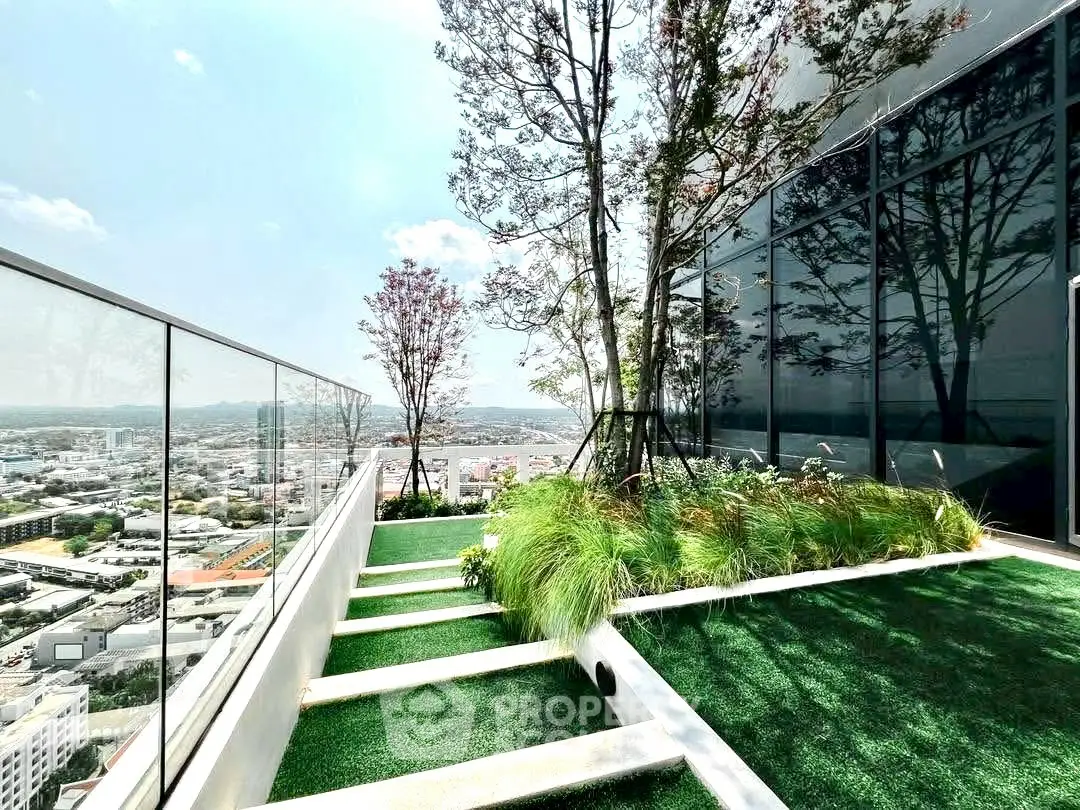 Stunning rooftop garden with panoramic city views and modern glass railing.
