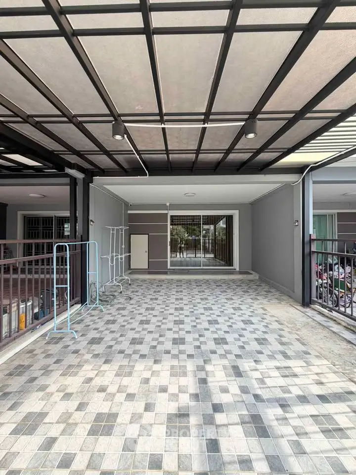 Spacious modern carport with tiled flooring and sleek design