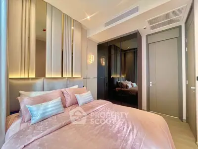 Luxurious modern bedroom with elegant decor and mirrored wardrobe