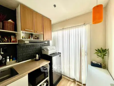 Modern kitchen with sleek appliances and natural light
