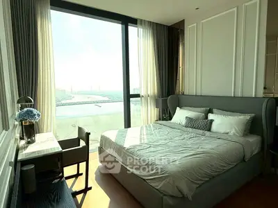 Luxurious bedroom with stunning river view and elegant decor