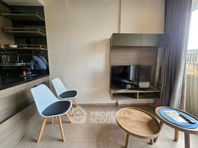 Modern living room with stylish furniture and wall-mounted TV