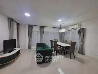 Spacious modern living room with elegant dining area and stylish furniture