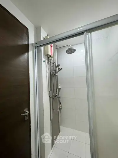 Modern bathroom with sleek shower design and sliding glass door