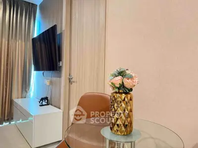 Modern living room with stylish decor and wall-mounted TV