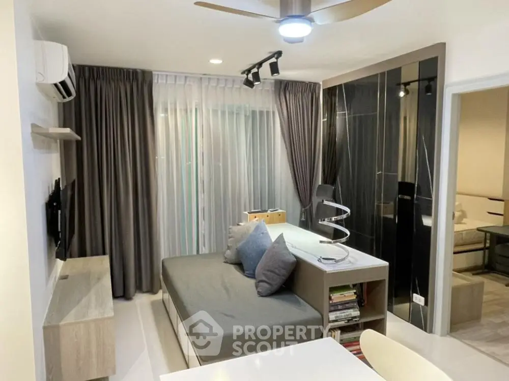 Modern living room with stylish decor and cozy seating area, perfect for relaxation and entertainment.