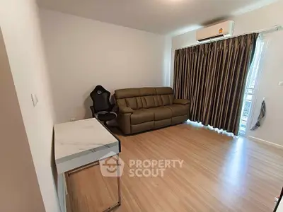 Modern living room with sleek furniture and wooden flooring