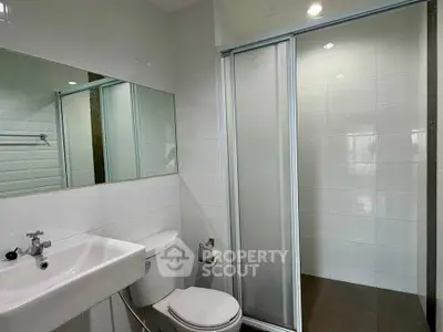 Modern bathroom with sleek shower and contemporary fixtures