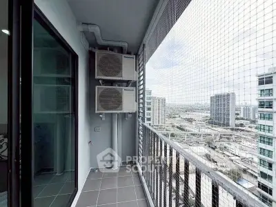 Modern high-rise balcony with city view and air conditioning units