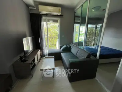 Modern living room with glass partition and cozy furniture in a stylish apartment