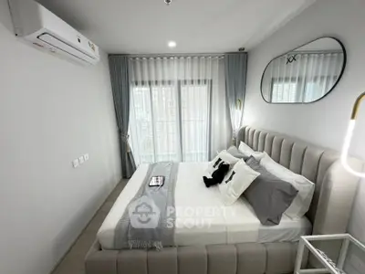 Modern bedroom with stylish decor and natural light