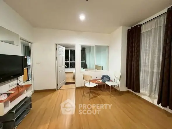 Spacious living room with modern decor and natural light