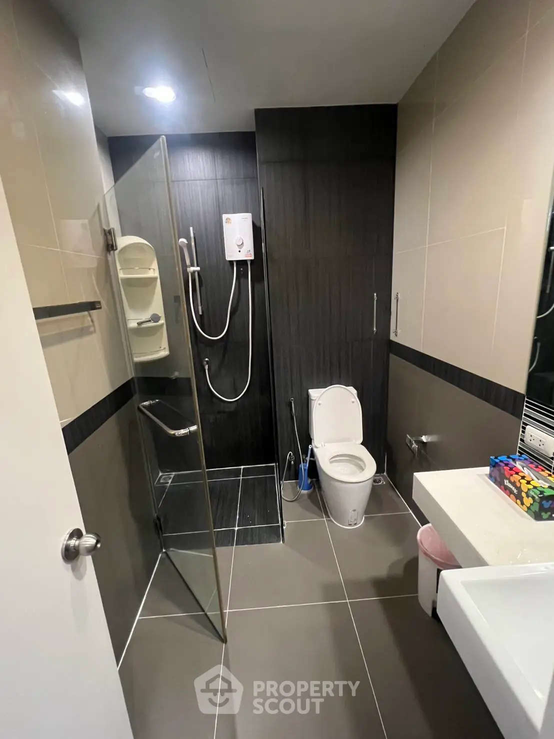 Modern bathroom with glass shower and sleek tile design