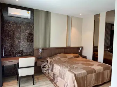 Luxurious bedroom with modern decor and elegant furnishings in a high-end real estate property.