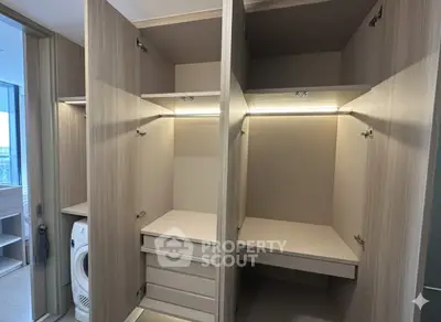 Spacious modern storage area with built-in washer and ample shelving