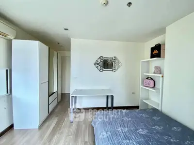 Modern bedroom with stylish decor and ample storage space