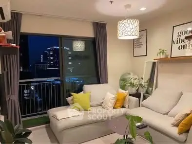 Cozy living room with modern decor and city view at night