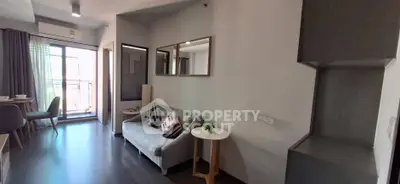 Modern living room with balcony access and stylish decor