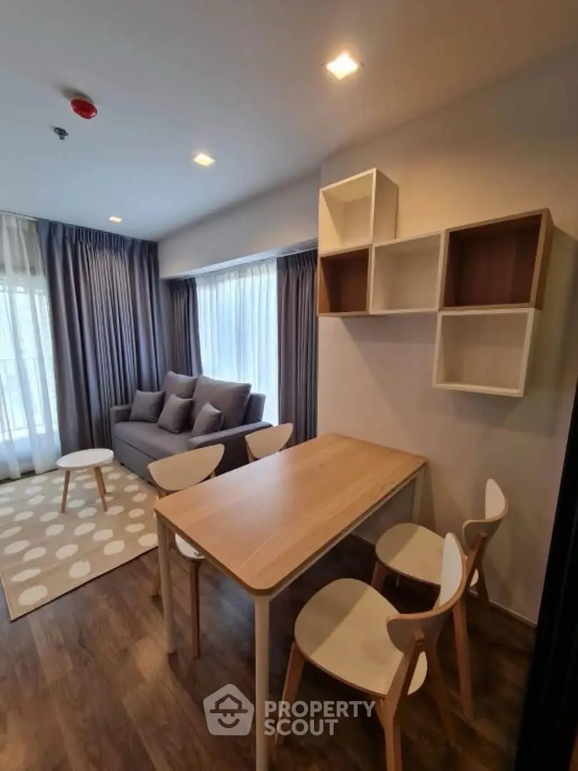 Modern living room with stylish furniture and natural light, perfect for cozy gatherings.