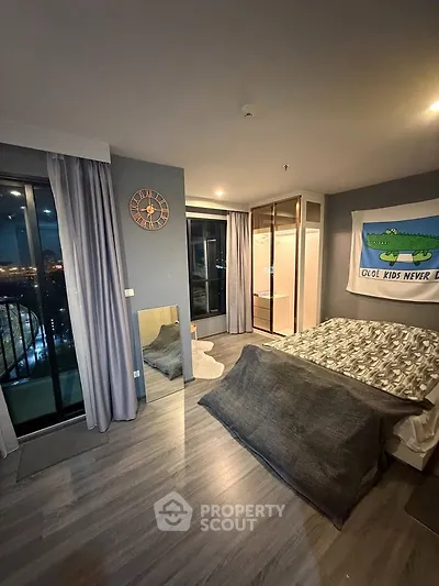 Modern bedroom with balcony view and stylish decor in urban apartment