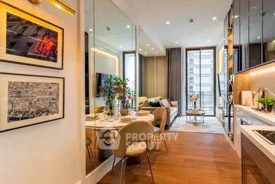 Luxurious open-plan living room with elegant dining area and modern kitchen in a stylish apartment.