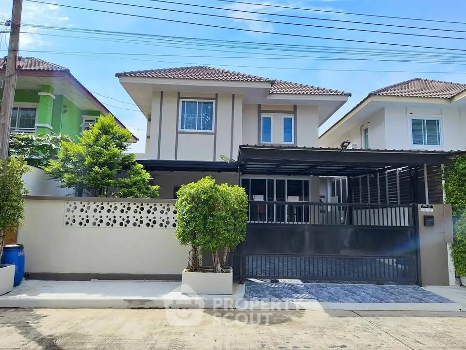 Charming two-story house with modern design and spacious driveway in a serene neighborhood.