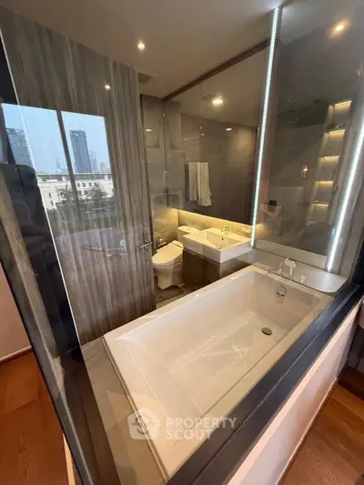 Luxurious modern bathroom with city view, featuring a sleek bathtub and elegant fixtures.