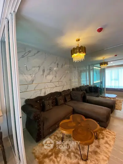 Luxurious living room with elegant brown sofa and chic lighting in modern apartment.