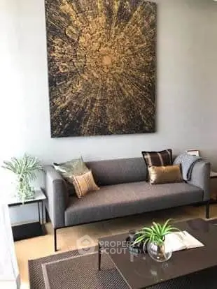 Stylish living room with modern sofa and abstract art, perfect for contemporary living.