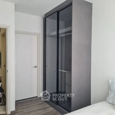 Modern bedroom with sleek built-in wardrobe and minimalist design