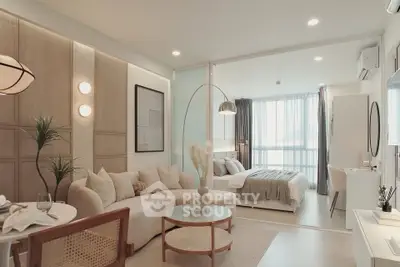 Stylish open-plan living room and bedroom with modern decor and natural light