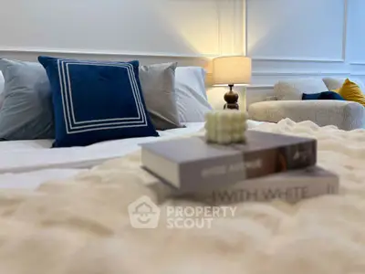 Luxurious bedroom with plush bedding and elegant decor, perfect for relaxation.