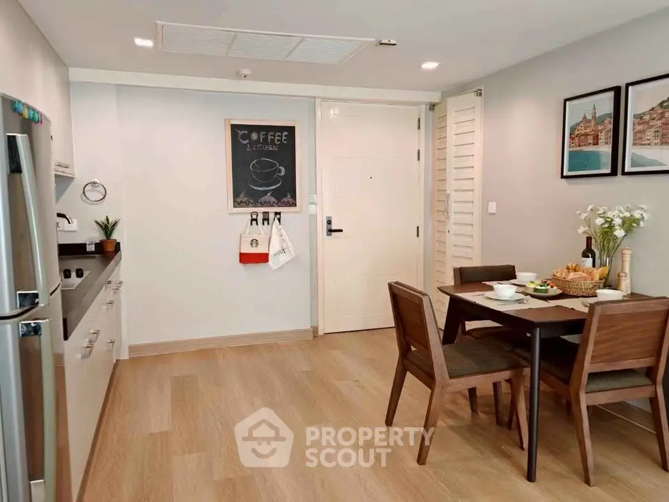 Modern kitchen and dining area with sleek appliances and stylish decor