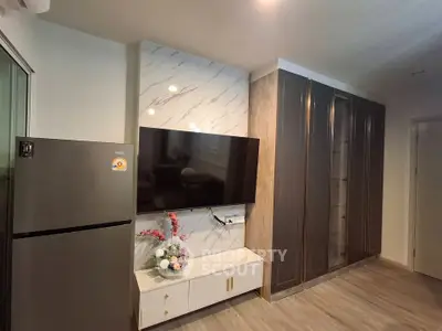 Modern living room with sleek TV setup and stylish storage solutions