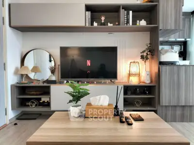 Modern living room with stylish wooden furniture and smart TV setup, perfect for cozy entertainment.