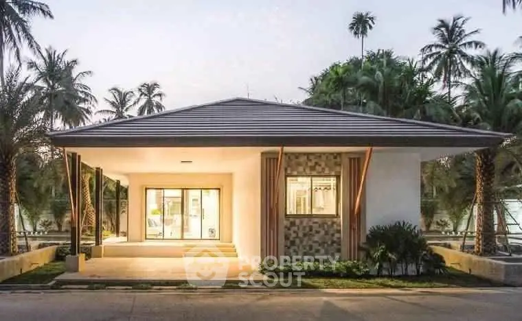 Modern tropical house with sleek design and lush surroundings
