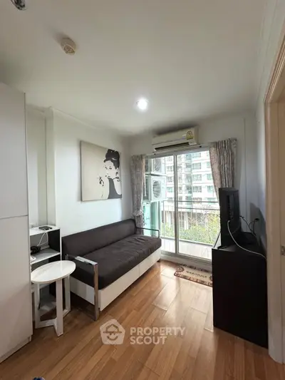 Cozy living room with balcony view in modern apartment