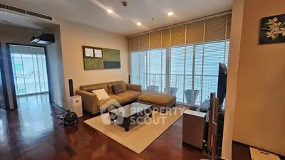 Spacious living room with modern decor and large windows for natural light.