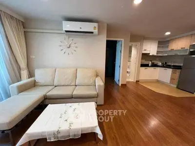 Spacious living room with modern kitchen in open layout apartment