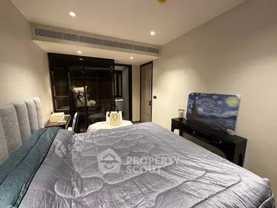 Modern bedroom with stylish decor and large bed, featuring a unique art piece on the dresser.